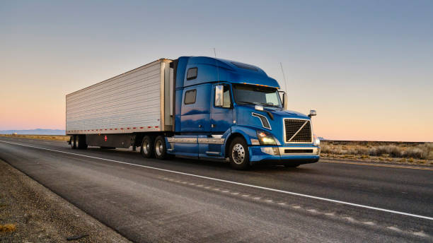 Expedited freight truck moving fast down highway