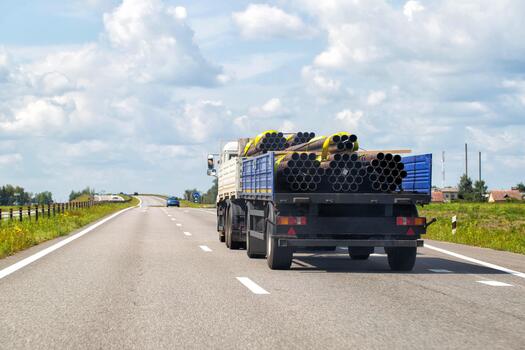 Flatbed commercial truck carrying industrial goods
