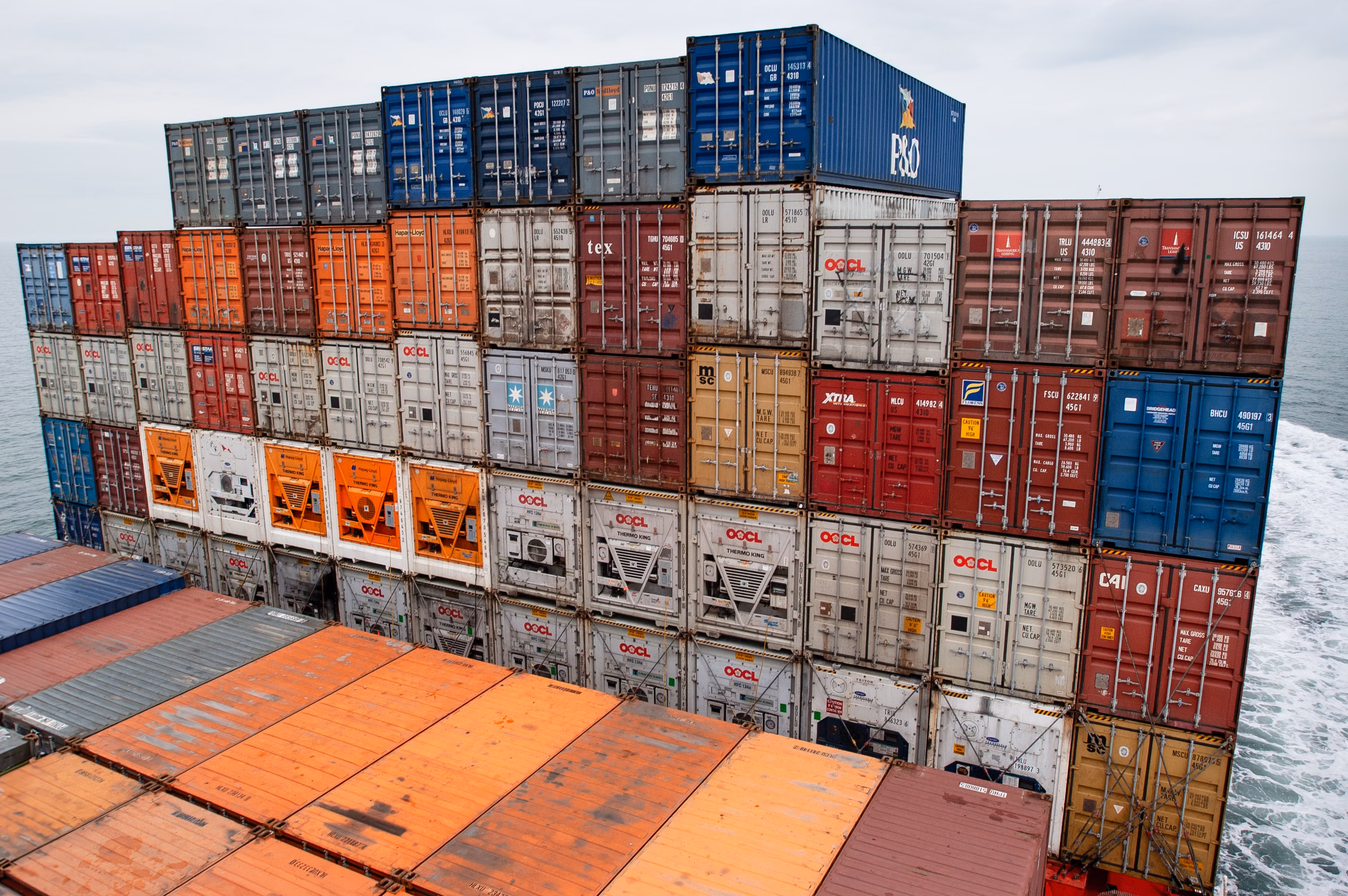 Global shipping containers stacked at cargo port